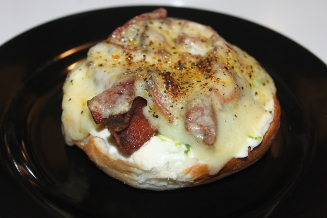 Gluten Free Bagel topped with Bacon, Avocado and Melted Swiss Cheese
